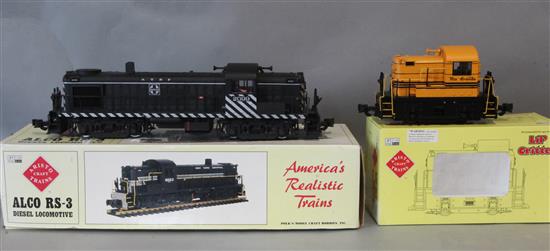 An Aristocraft G gauge Alco RS-3 diesel locomotive and a Lil Critter Rio Grande diesel locomotive ART 22506, both boxed